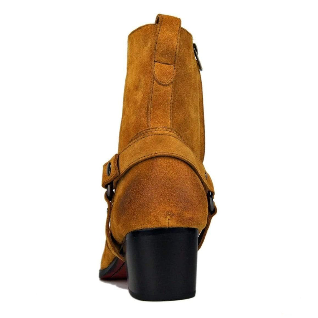 Back of a brown suede cowboy boot with a black block heel.