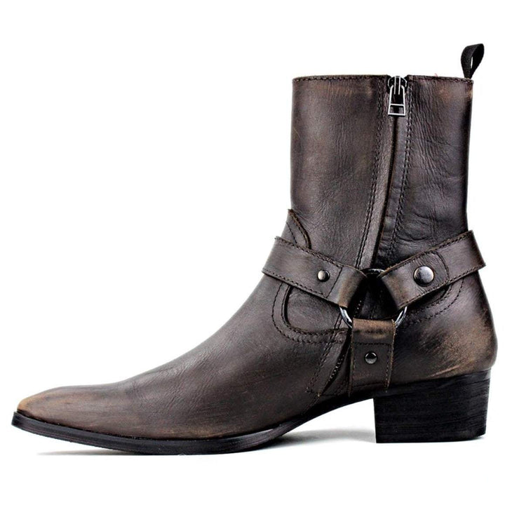 A brown leather boot with a harness.