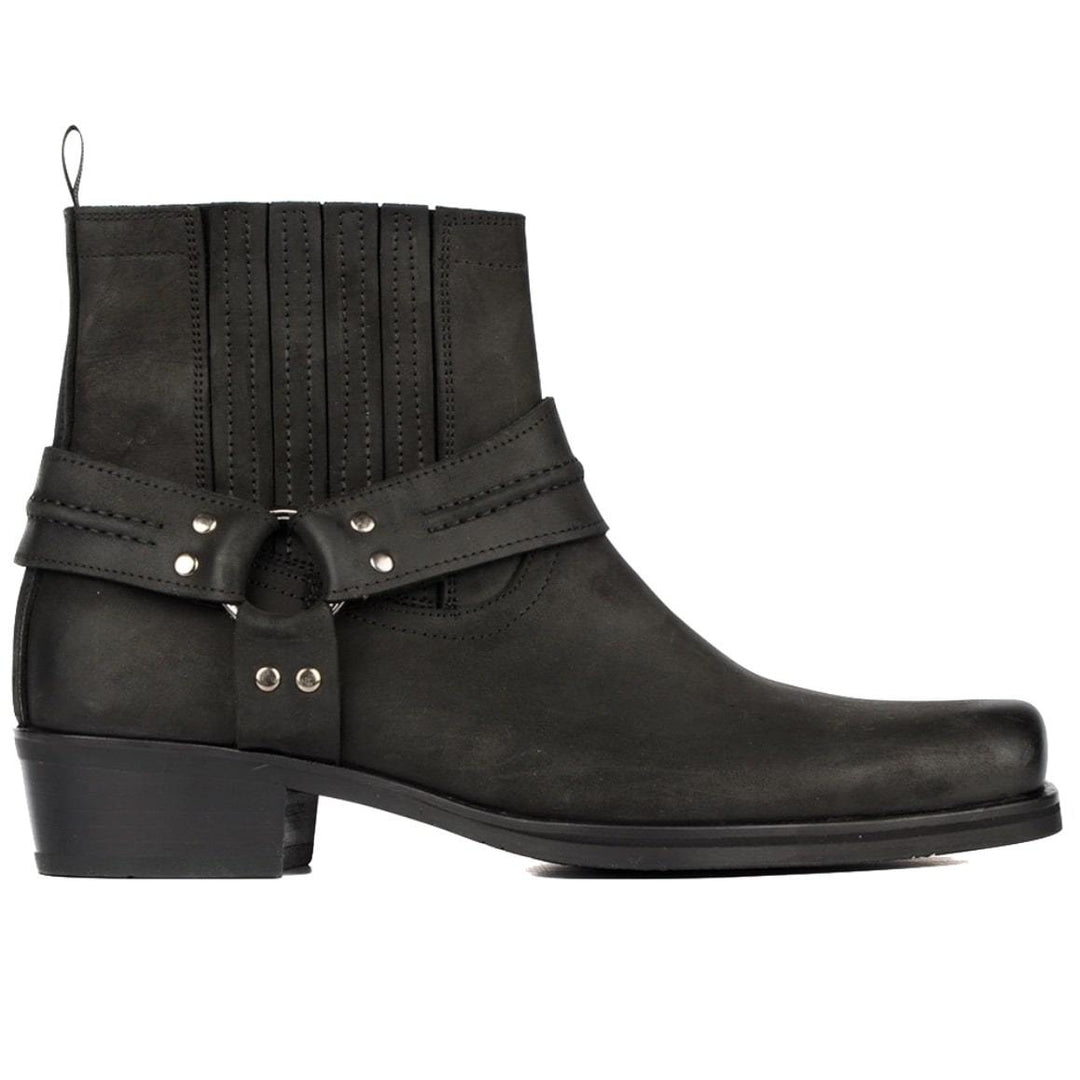 Black leather harness boot with silver hardware.