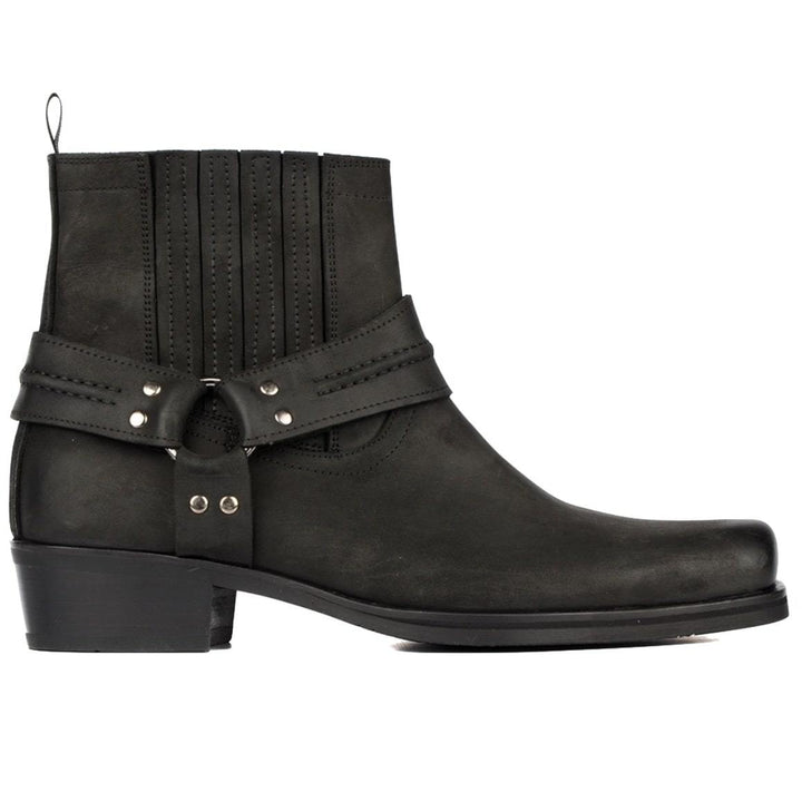 Black leather harness boot with silver hardware.