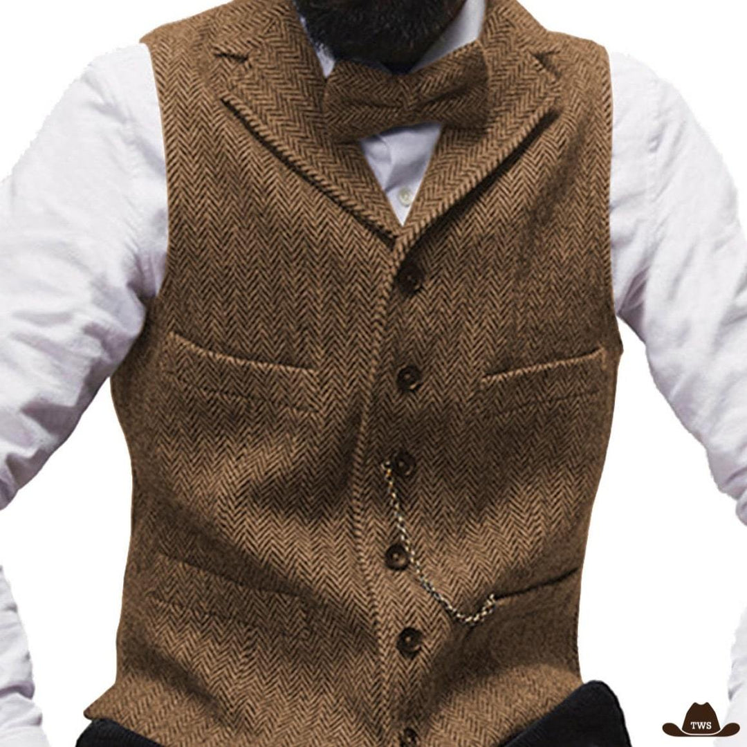 Brown herringbone waistcoat and bowtie, white shirt.
