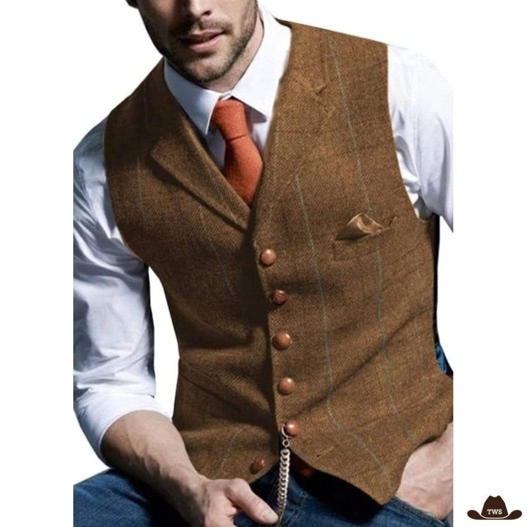 Man in brown tweed waistcoat, white shirt, and orange tie.