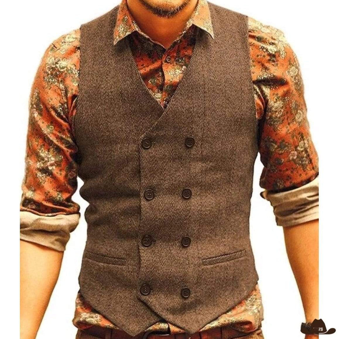Man wearing brown double-breasted vest over floral shirt.